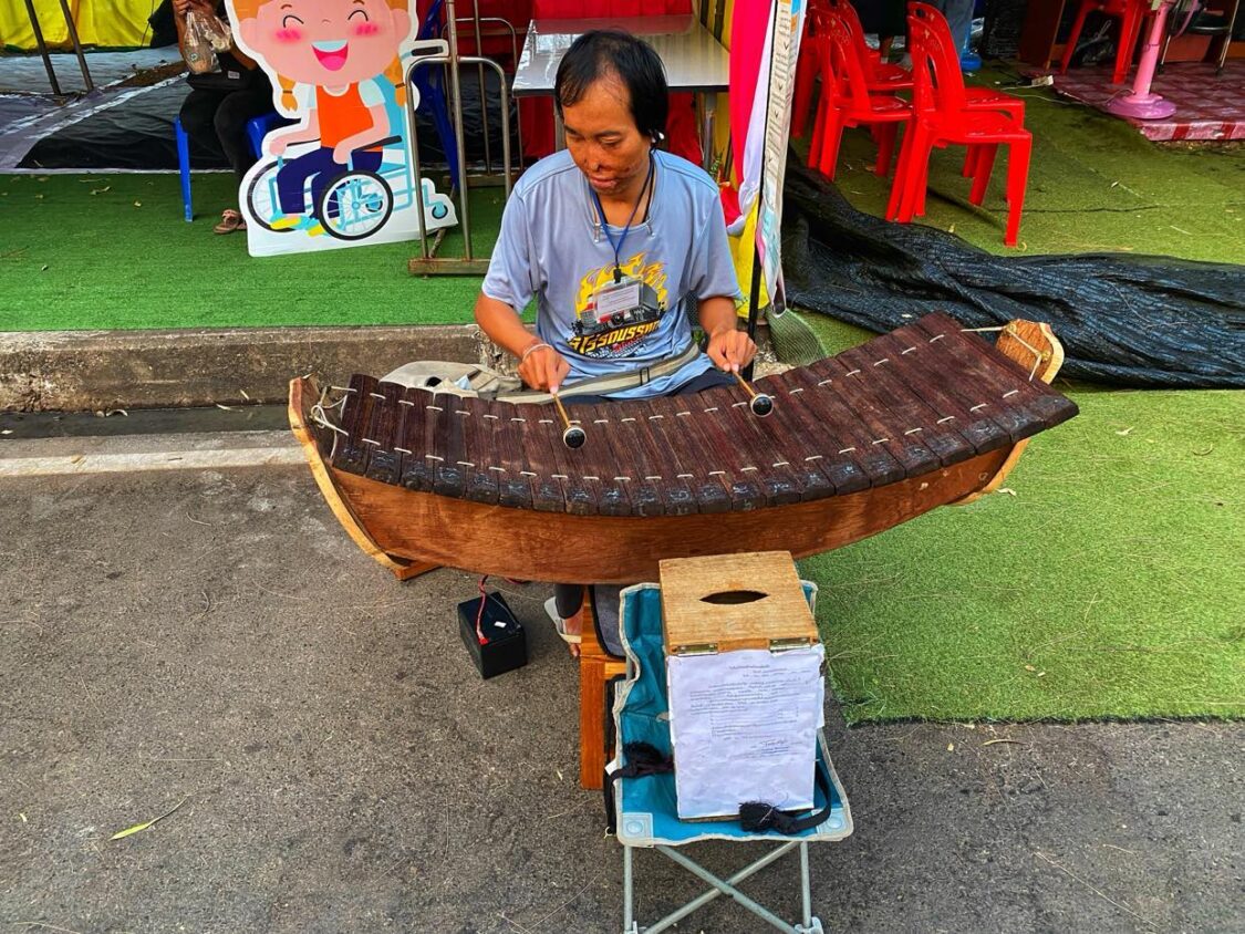 Thai Blind Musician Playing the Thai Xylophone